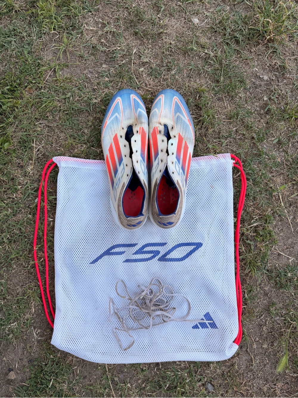 Adizero F50 elite FG “Advancement Pack” cleats